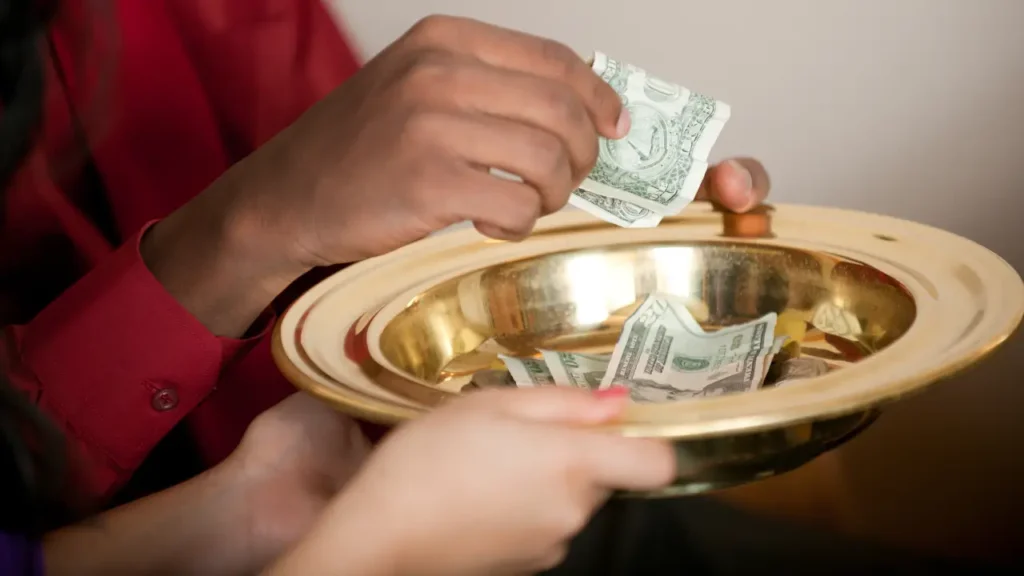 A cash donation being collected during a wake