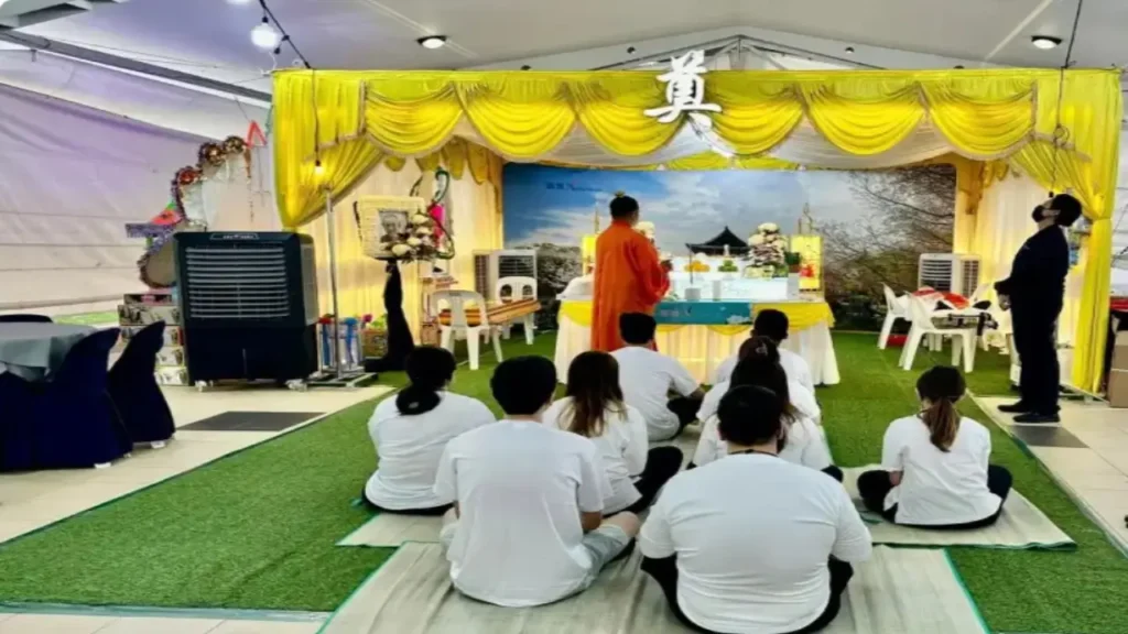 People gathered in a Taoist funeral ceremony