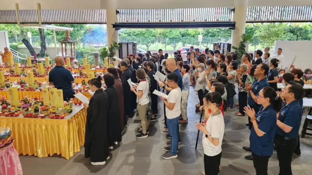 People gathered in a buddhist funeral ceremony