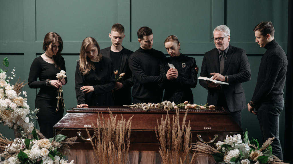 family gathered around a casket